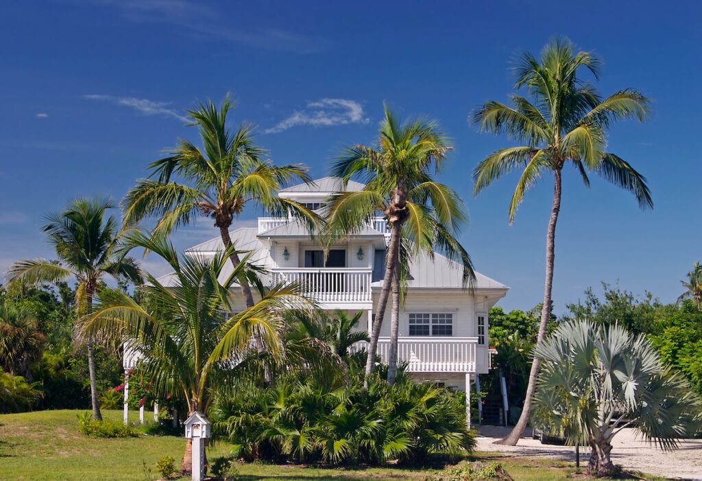 Tropical beach setting with a beautiful Florida style home