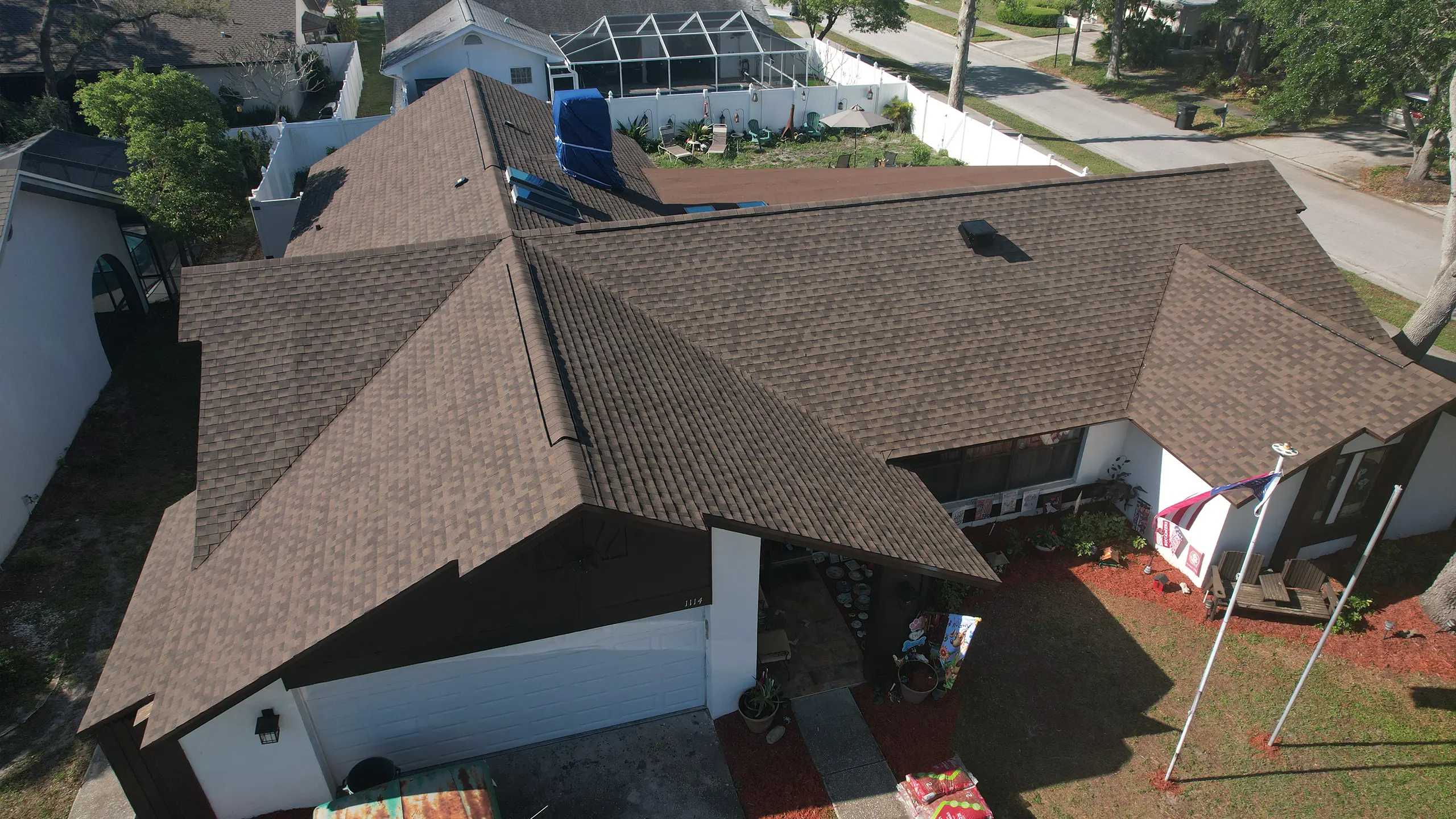 A one-story house with brown shingles
