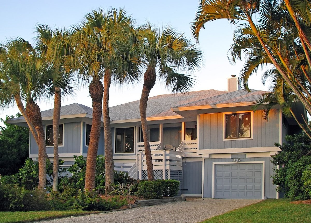 A light blue house with shingles