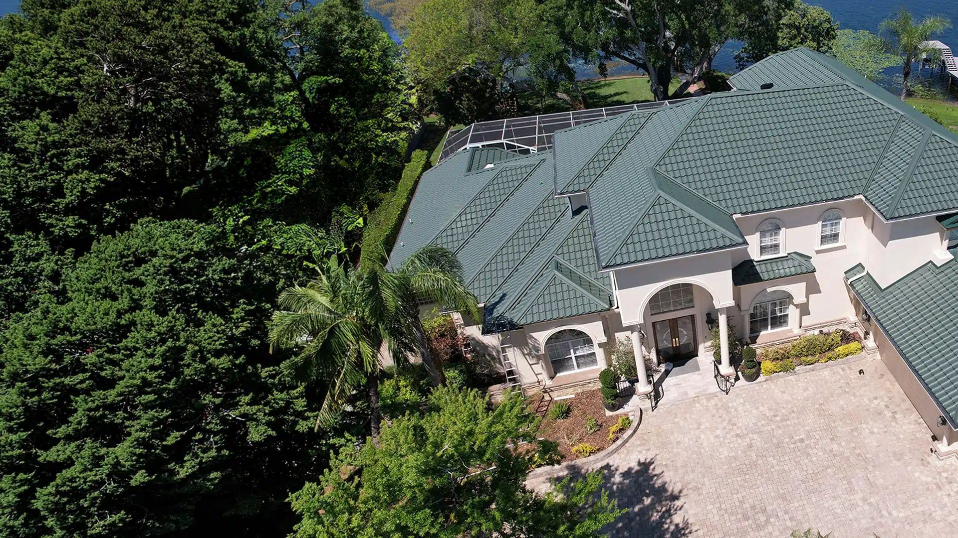 Home with green Worthouse metal roofing system