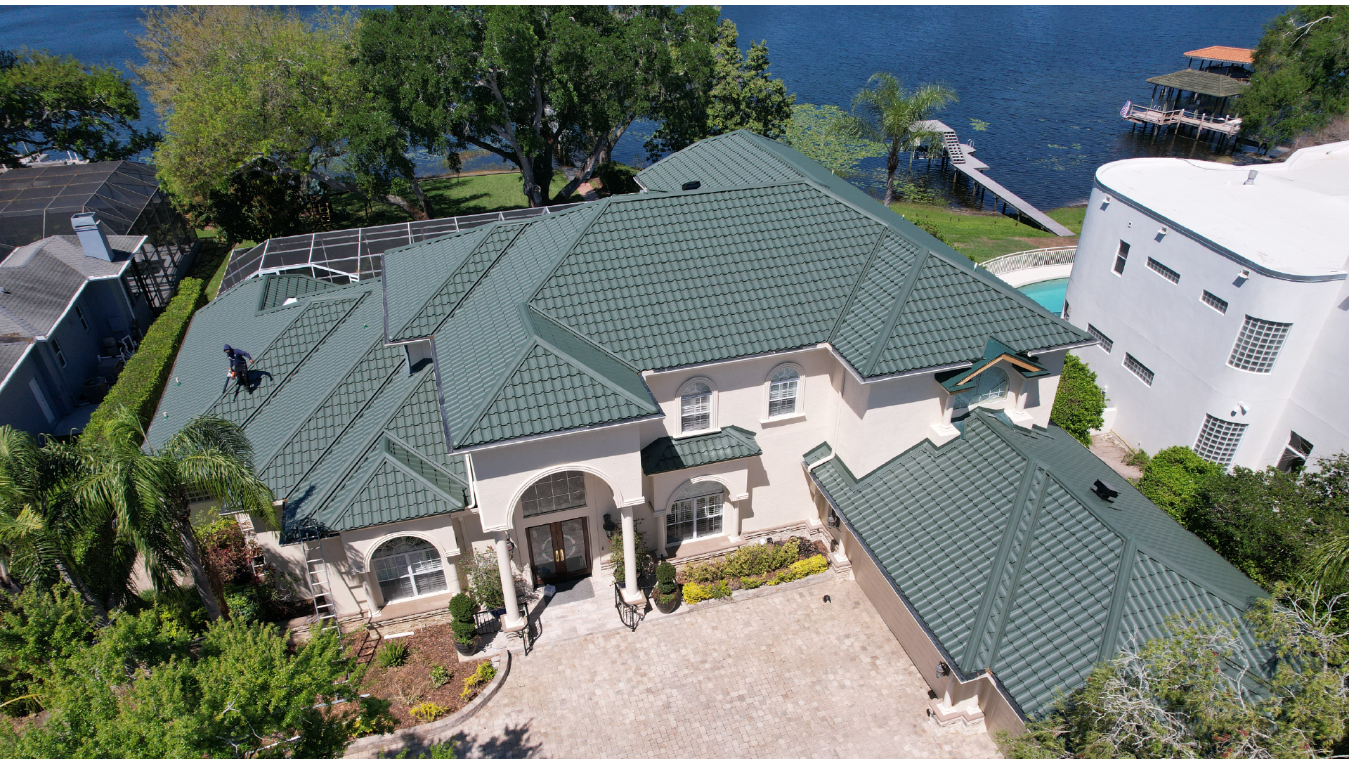 Large home with Green Worthouse metal roof